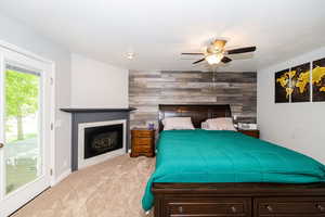 Primary bedroom w/ gas FP & French doors to hot tub (included) ensuite bath