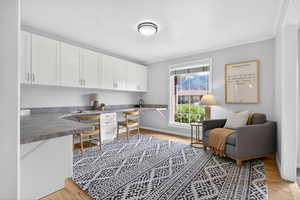 Office space with a built in desk.  This space could easily be transformed into a semi-formal dining room or game room.