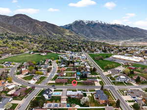 Aerial overview of property's location featuring panoramic mountain background