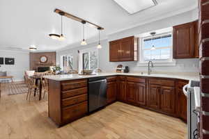 Open kitchen featuring a peninsula with bar seating