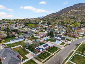 Aerial view of residential area with a panoramic mountain background
