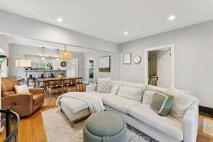 Living area featuring wood finished floors and recessed lighting