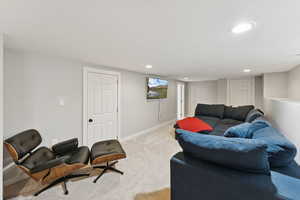 Living room featuring recessed lighting and light colored carpet