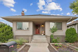 Bungalow featuring a chimney and a vegetable garden