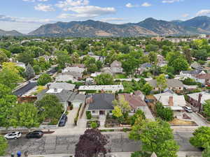 Aerial perspective of suburban area with a mountain backdrop