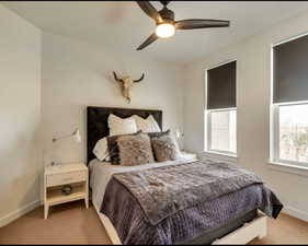 Bedroom with carpet floors and a ceiling fan