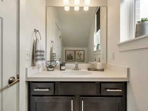 Bathroom with vanity and healthy amount of natural light