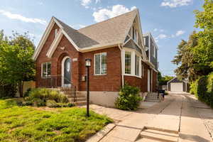 English style home with a detached garage,