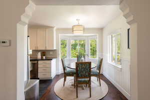 Dining room dark wood flooring.