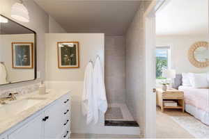 Main suite bedroom, ensuite bath, vanity, tiled shower.