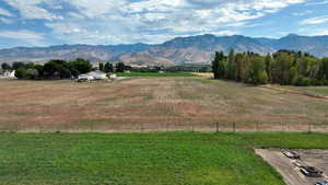 View of mountain background featuring rural landscape