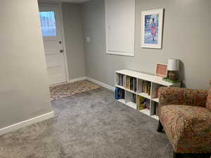Living area featuring wood finished floors and carpet floors