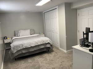 Bedroom featuring carpet floors and a closet