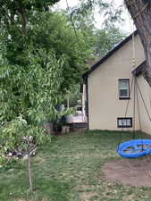 View of green lawn featuring a trampoline