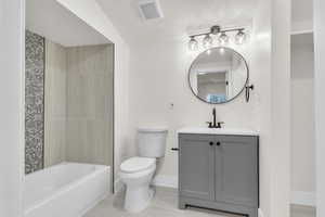 Full bath featuring vanity,  shower combination, and tile patterned flooring