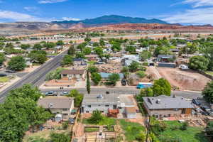 Aerial perspective of suburban area featuring a mountain backdrop