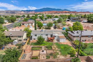 Aerial view of residential area with a mountain backdrop
