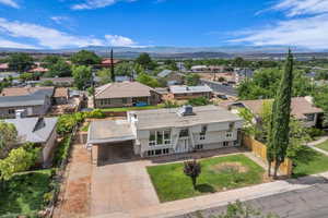 Aerial view of residential area featuring mountains