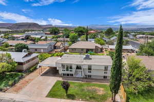 Aerial view of residential area with a mountainous background