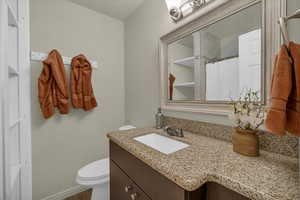 Bathroom featuring vanity and a shower with shower curtain