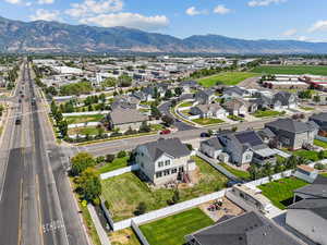 Aerial perspective of suburban area featuring a mountain backdrop