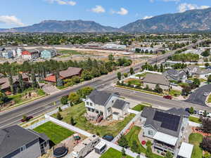 Aerial view of residential area featuring a mountainous background