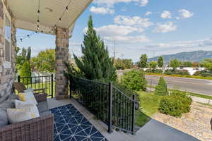 View of patio / terrace featuring an outdoor living space and a mountain view