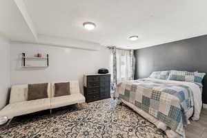 Bedroom with a textured ceiling