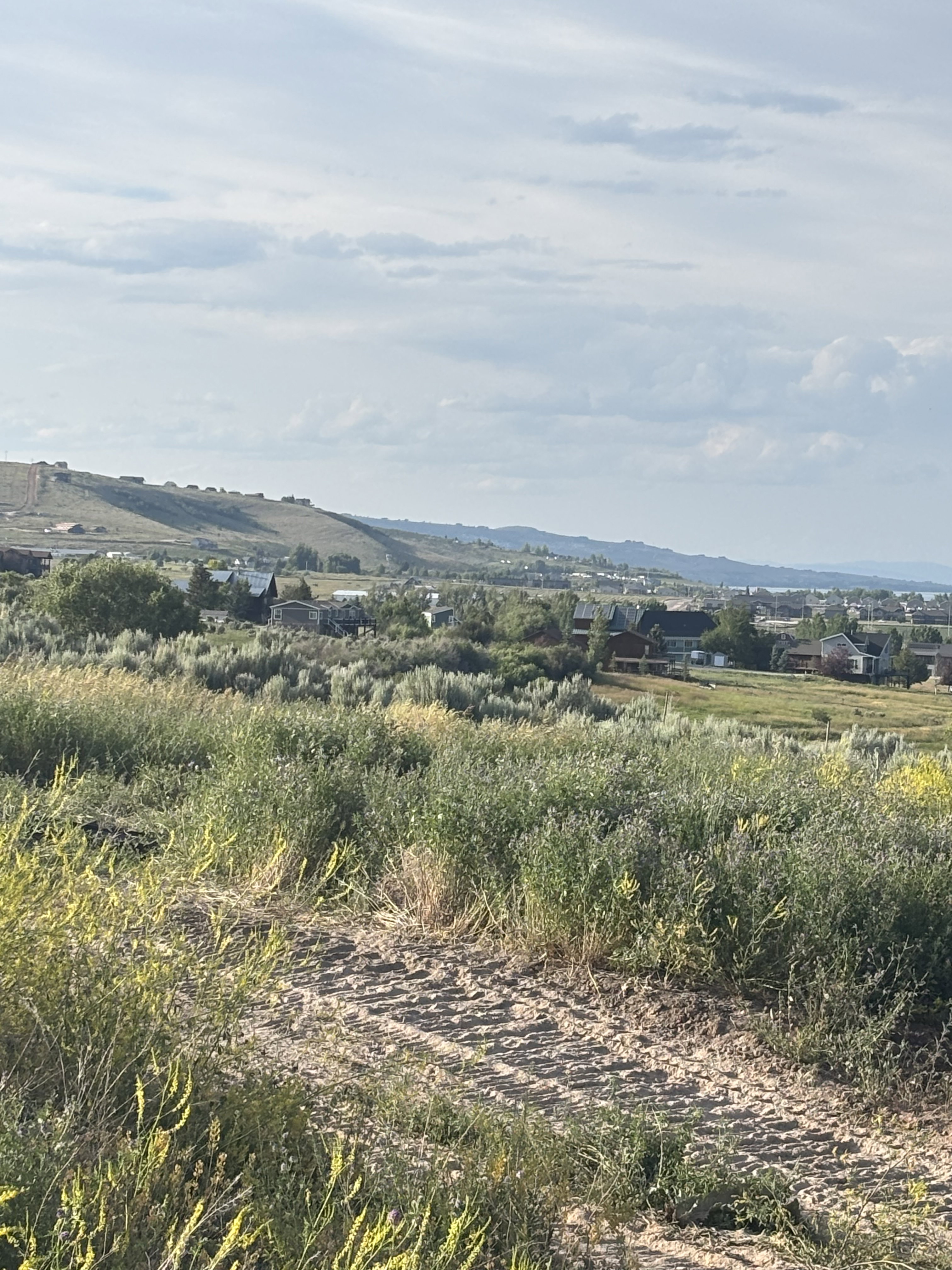View of mountain backdrop with rural landscape