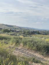 View of mountain backdrop with rural landscape
