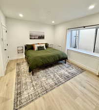 Bedroom featuring recessed lighting and light wood finished floors