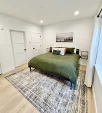Bedroom featuring light wood-style flooring and recessed lighting