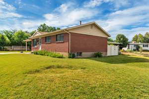 View of side of property featuring brick siding