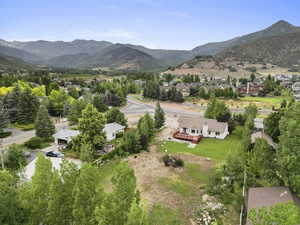 Aerial perspective of suburban area with a mountain backdrop