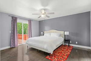 Bedroom with access to exterior, wood finished floors, and a ceiling fan