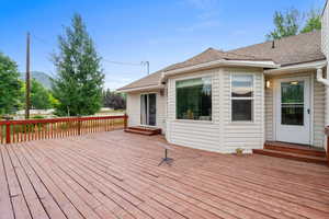 Wooden terrace featuring entry steps