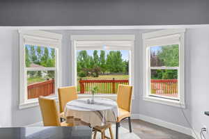 Dining area featuring wood finished floors and baseboards