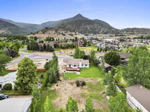 Aerial perspective of suburban area featuring a mountainous background