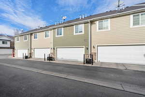Rear view of house featuring a garage