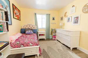 Bedroom featuring wood finished floors
