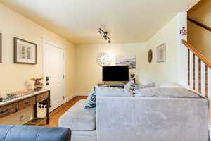 Living room featuring wood finished floors and baseboards