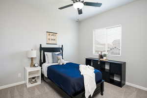 Bedroom with carpet and a ceiling fan