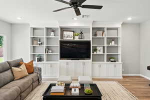 Living area featuring light wood finished floors and ceiling fan