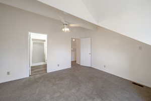 Bonus room with a ceiling fan, carpet, and lofted ceiling