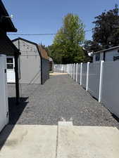 View of yard featuring a storage unit
