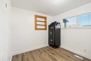 Empty room with wood finished floors and baseboards