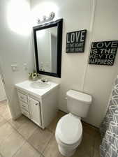 Full bathroom featuring vanity and tile patterned floors