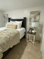 Bedroom featuring light tile patterned flooring