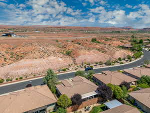Aerial perspective of suburban area with a mountain backdrop