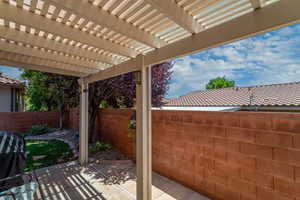 Fenced backyard with a patio area and a pergola